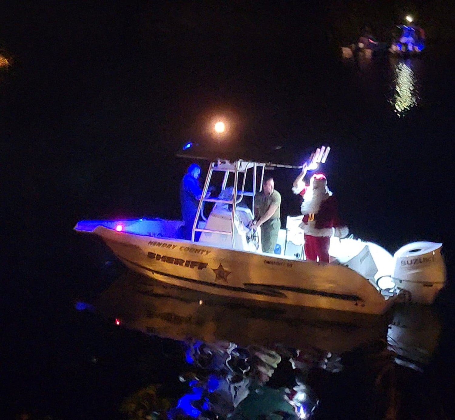 LABELLE – The Hendry County Sheriff’s Office boat led the boat parade, with Santa waving to those on shore. [Photo courtesy of Hendry County Sheriff’s Office]